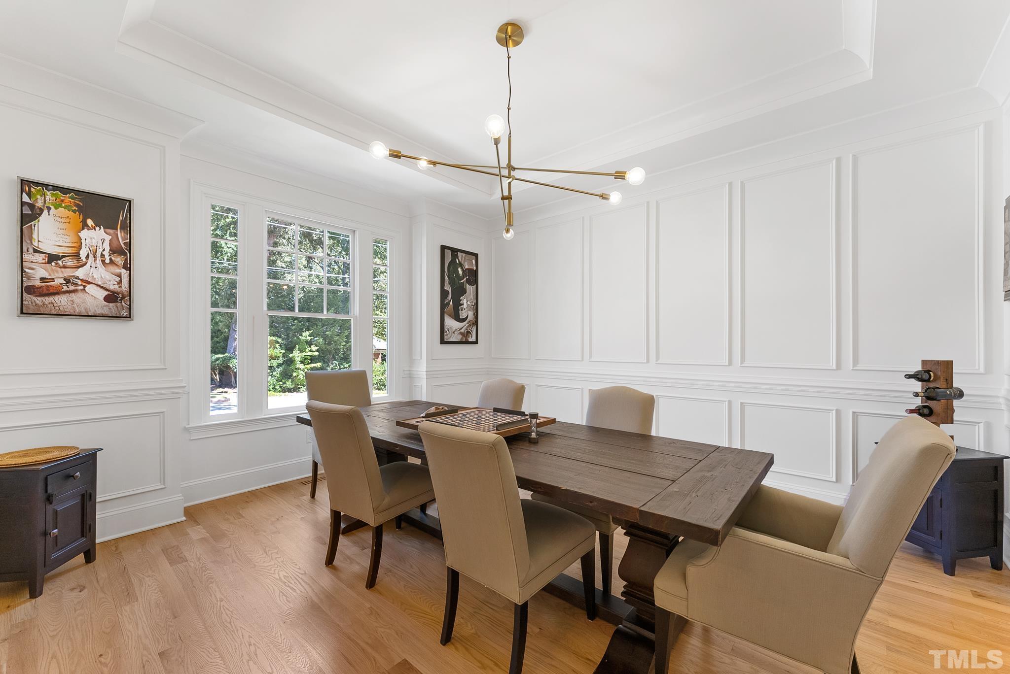 3401 Lewis Farm Road Raleigh, NC 27607 - Photo 7 of 75 a view of a dining room with furniture window and wooden floor