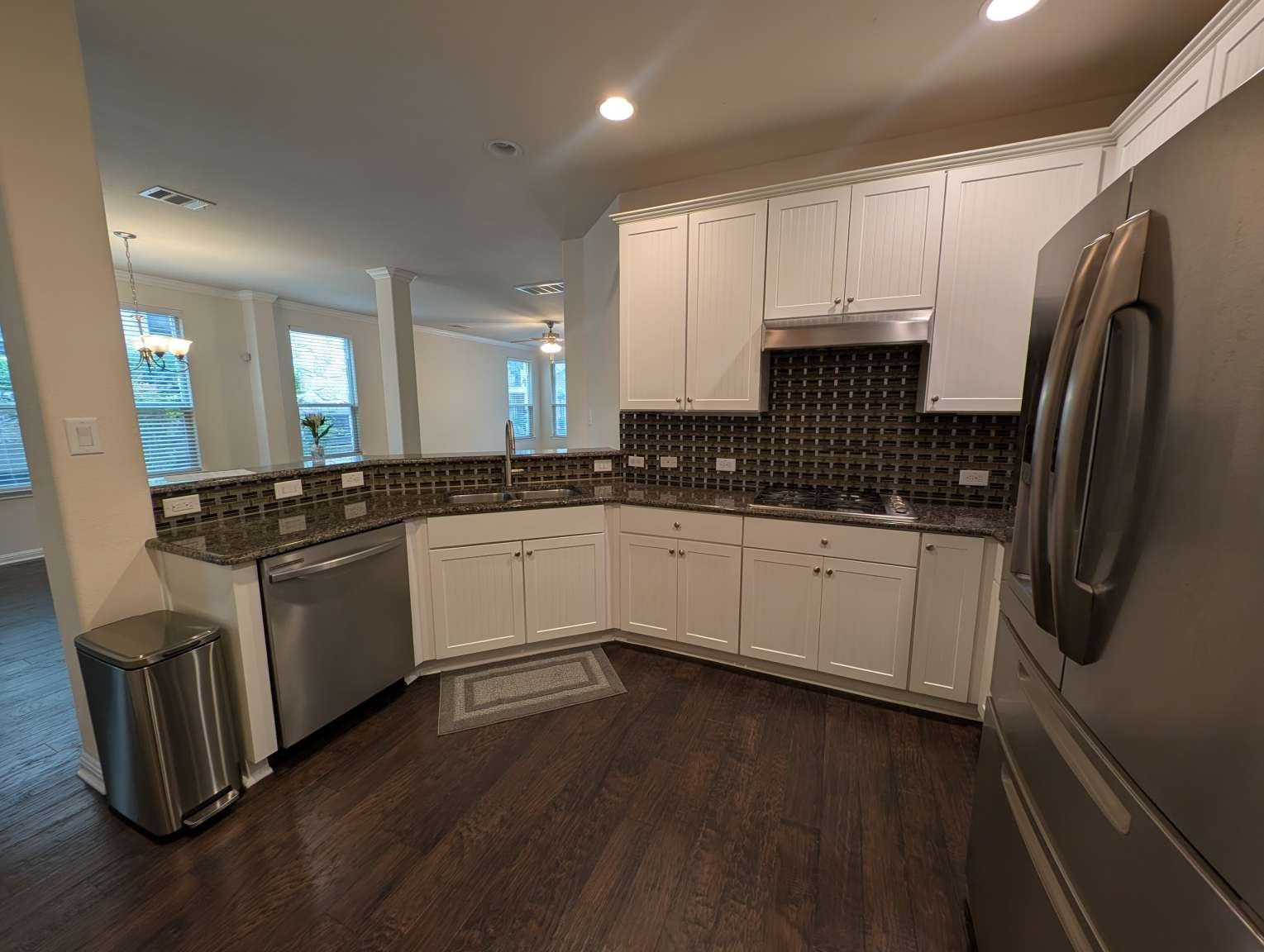 7301 Bandera Ranch Trail, Unit A Austin, TX 78750 - Photo 6 of 20 Granite counters and stainless steel appliances adorn this well-appointed kitchen.