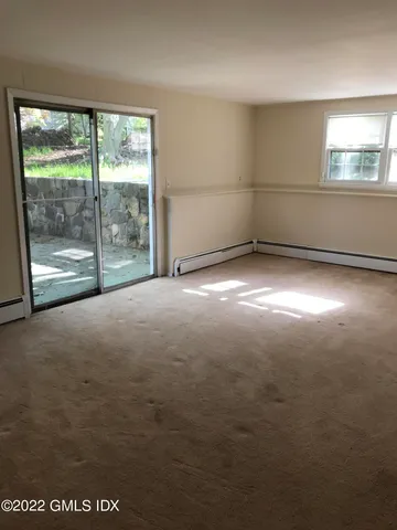 a view of a room with a large window