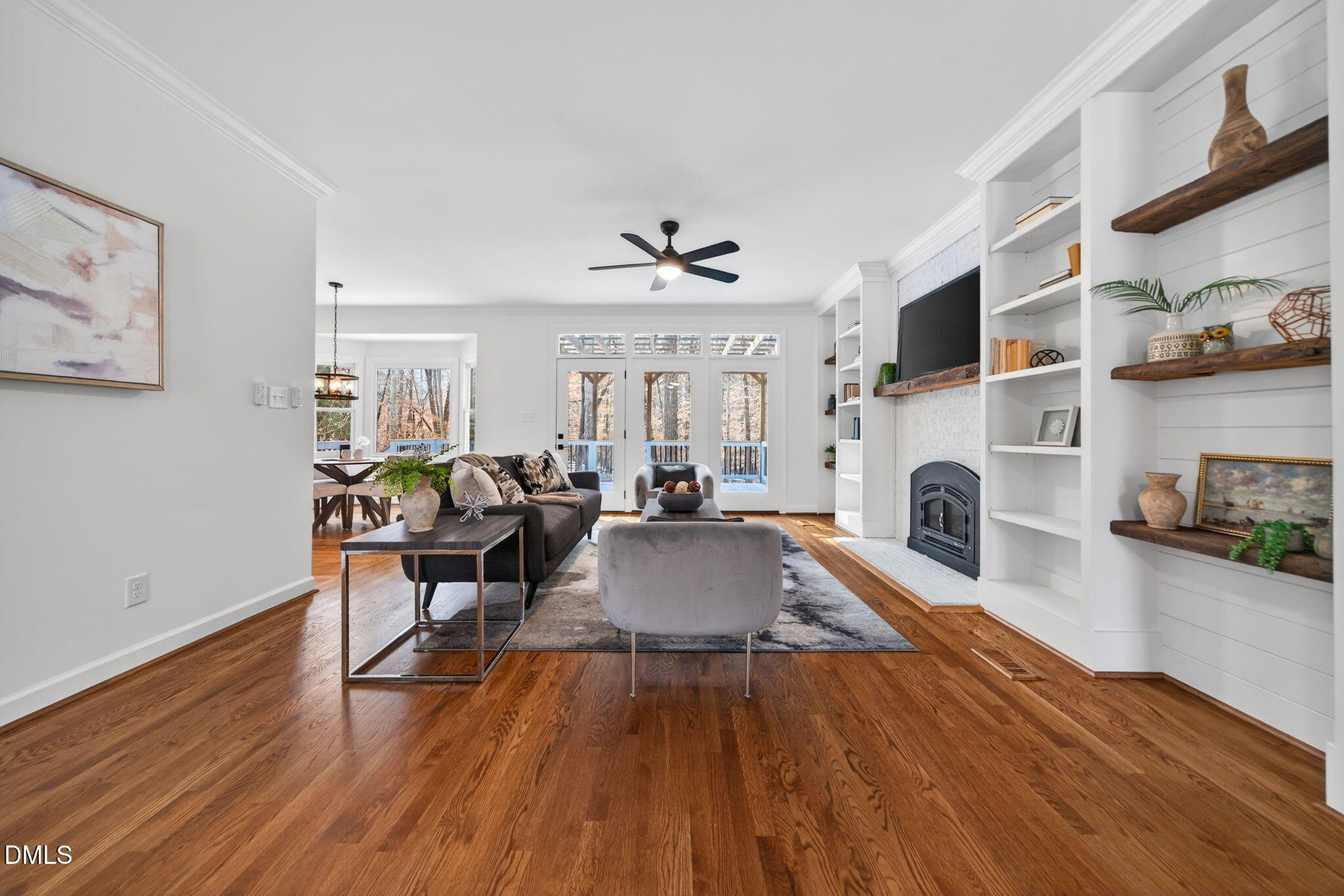 11505 Burberry Drive Raleigh, NC 27614 - Photo 11 of 80 a living room with furniture a fireplace and a flat screen tv