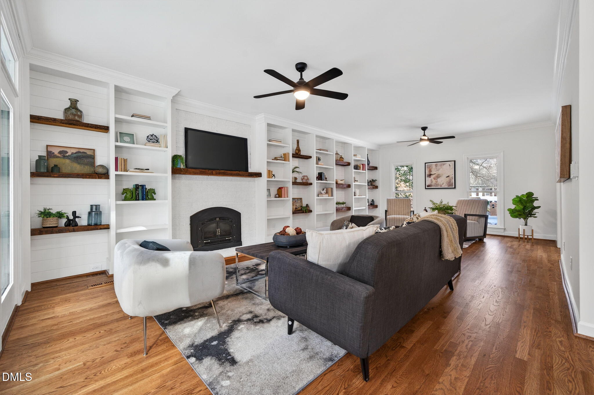 11505 Burberry Drive Raleigh, NC 27614 - Photo 15 of 80 a living room with furniture a flat screen tv and a fireplace