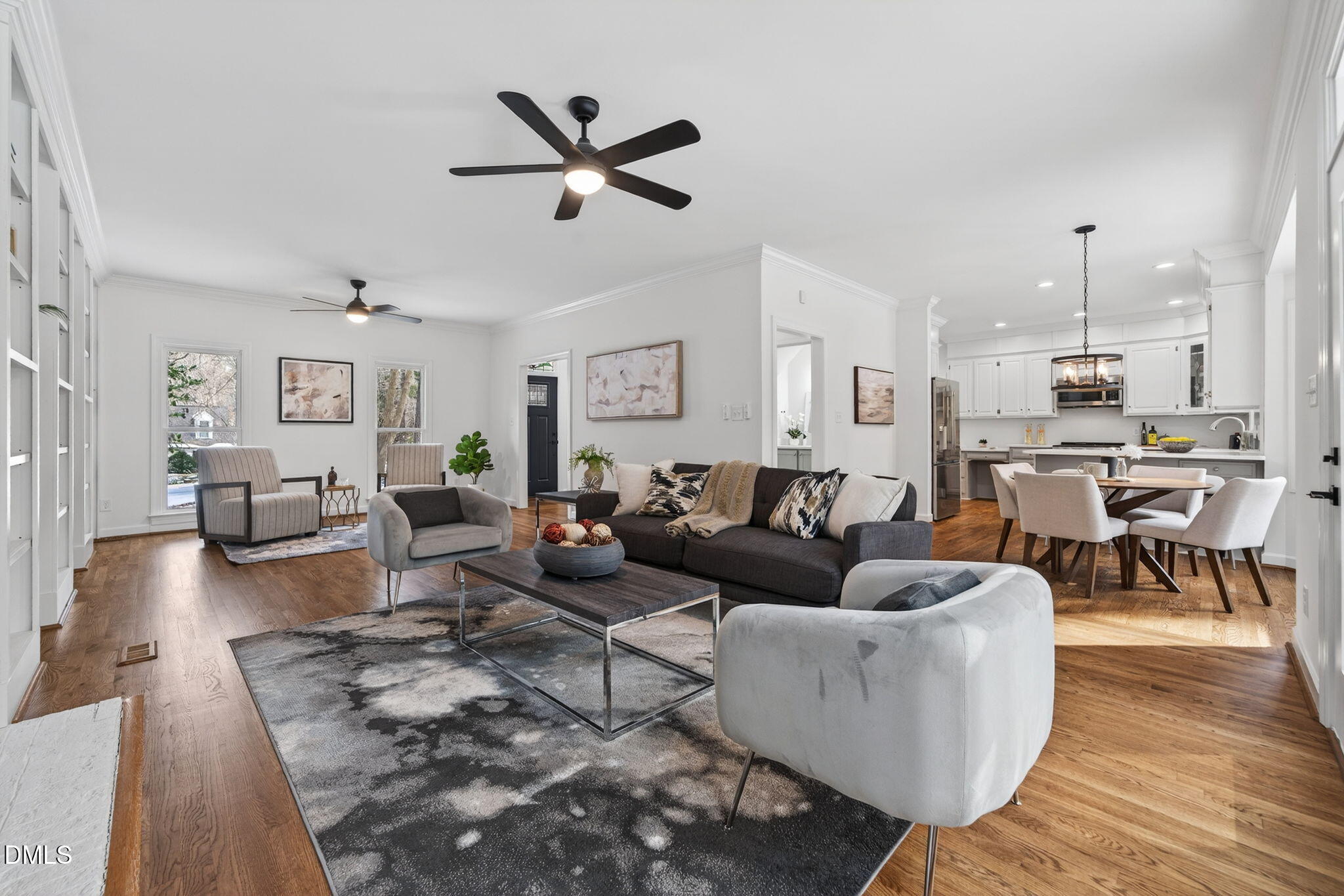 11505 Burberry Drive Raleigh, NC 27614 - Photo 16 of 80 a living room with furniture kitchen view and a wooden floor