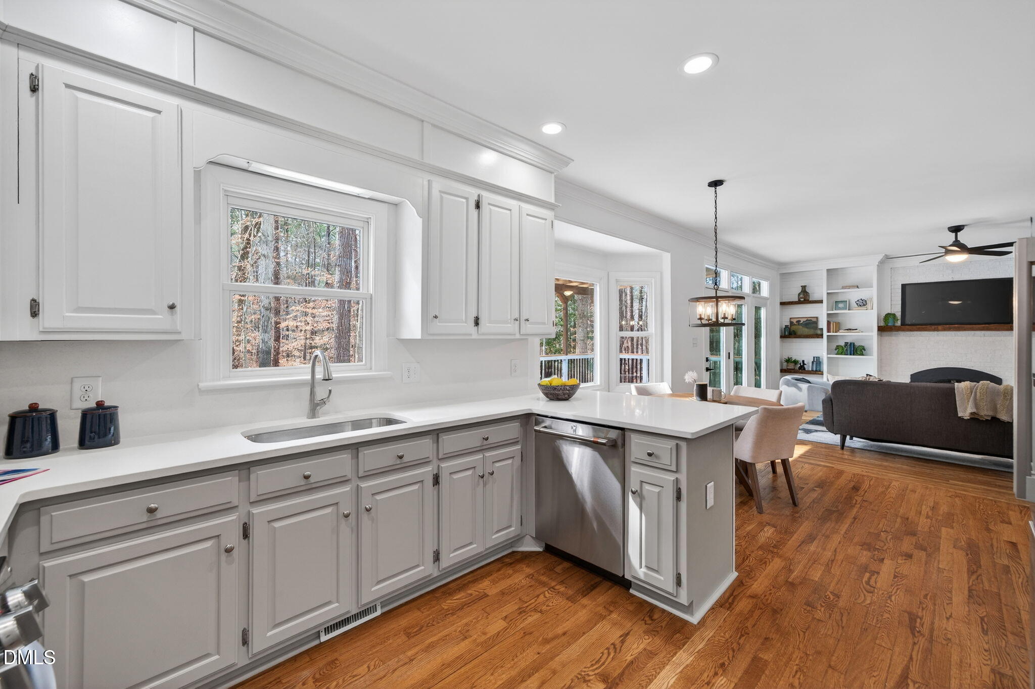 11505 Burberry Drive Raleigh, NC 27614 - Photo 21 of 80 a kitchen with stainless steel appliances granite countertop a sink a stove and wooden floors
