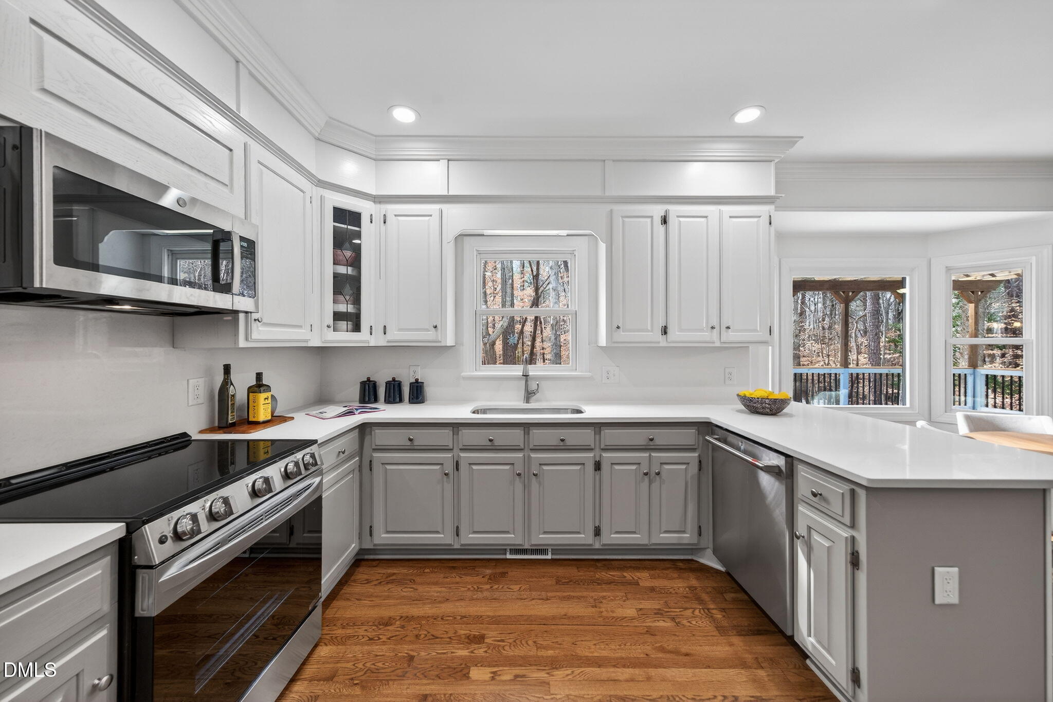 11505 Burberry Drive Raleigh, NC 27614 - Photo 22 of 80 a kitchen with stainless steel appliances granite countertop a sink and stove top oven