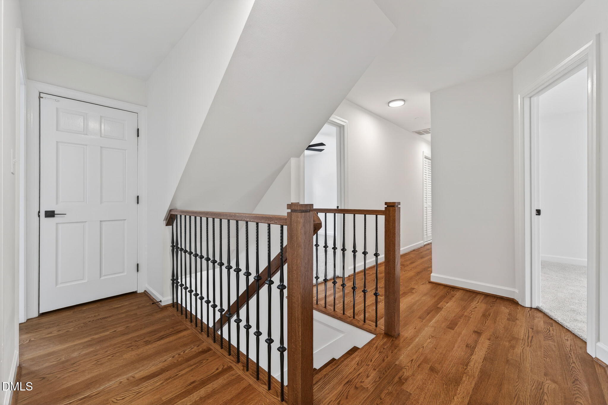 11505 Burberry Drive Raleigh, NC 27614 - Photo 25 of 80 a view of a hallway with wooden floor and staircase