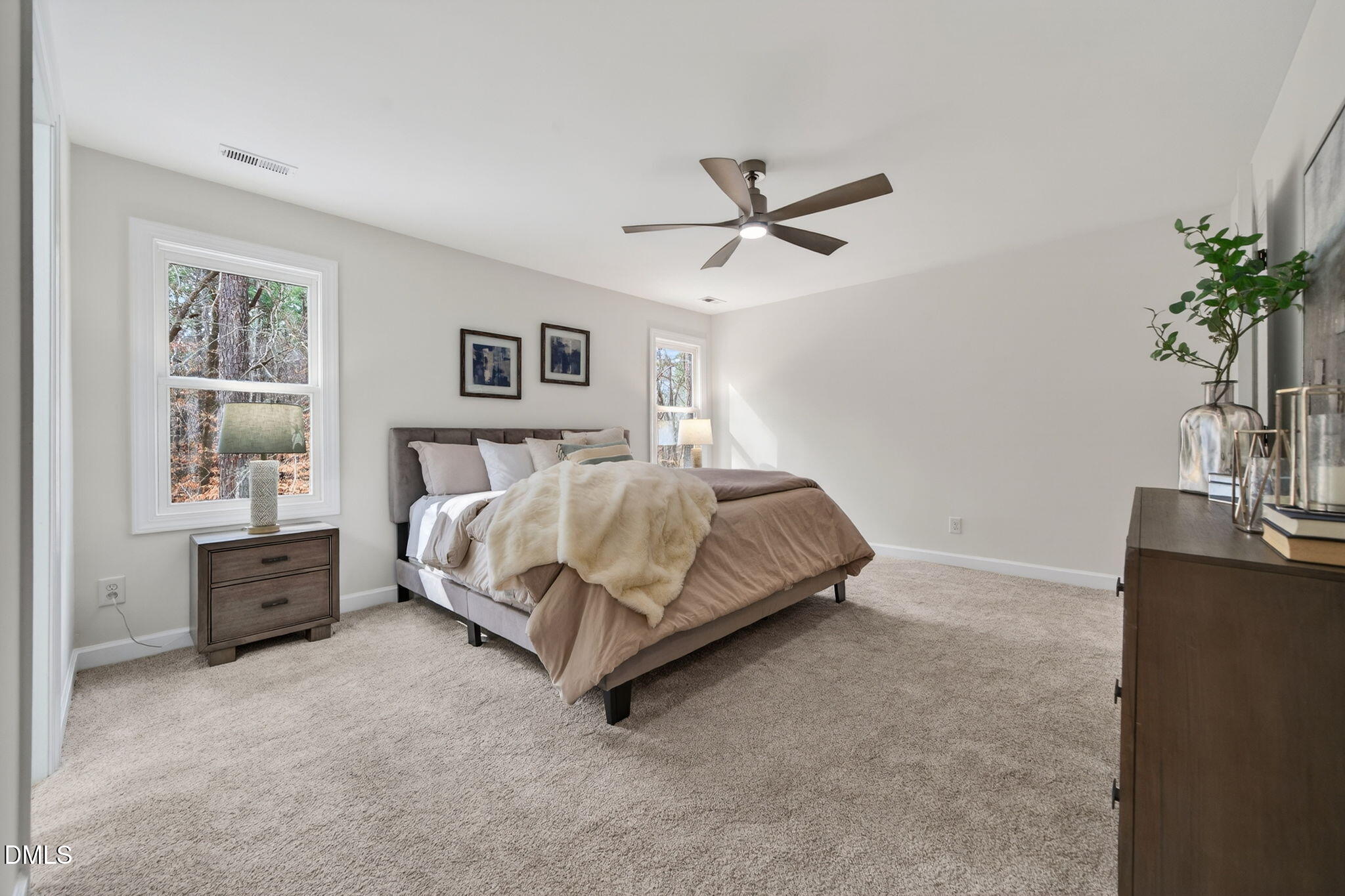 11505 Burberry Drive Raleigh, NC 27614 - Photo 26 of 80 a bedroom with a bed and a potted plant on the dresser