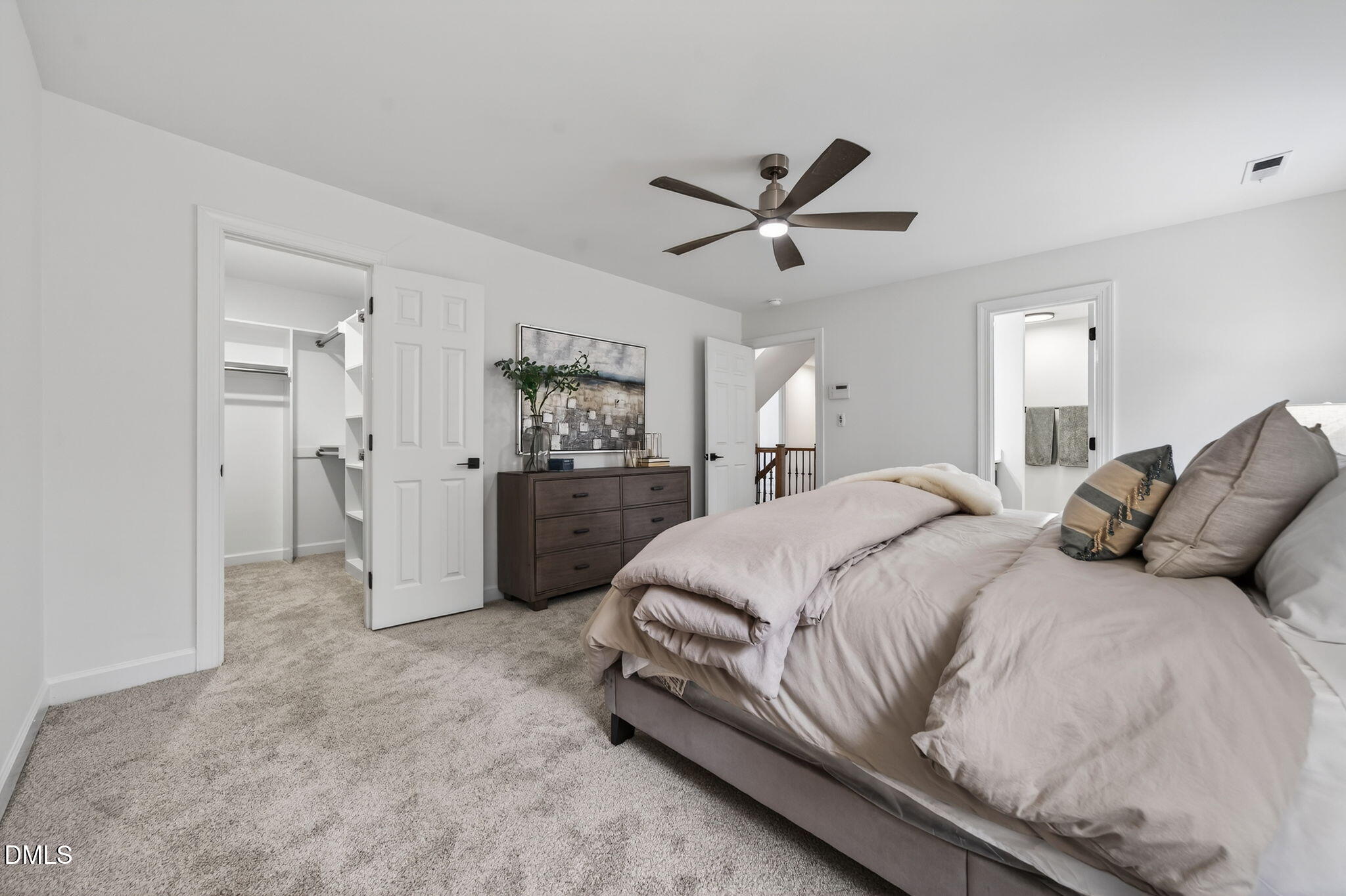 11505 Burberry Drive Raleigh, NC 27614 - Photo 27 of 80 a spacious bedroom with a bed and a chandelier