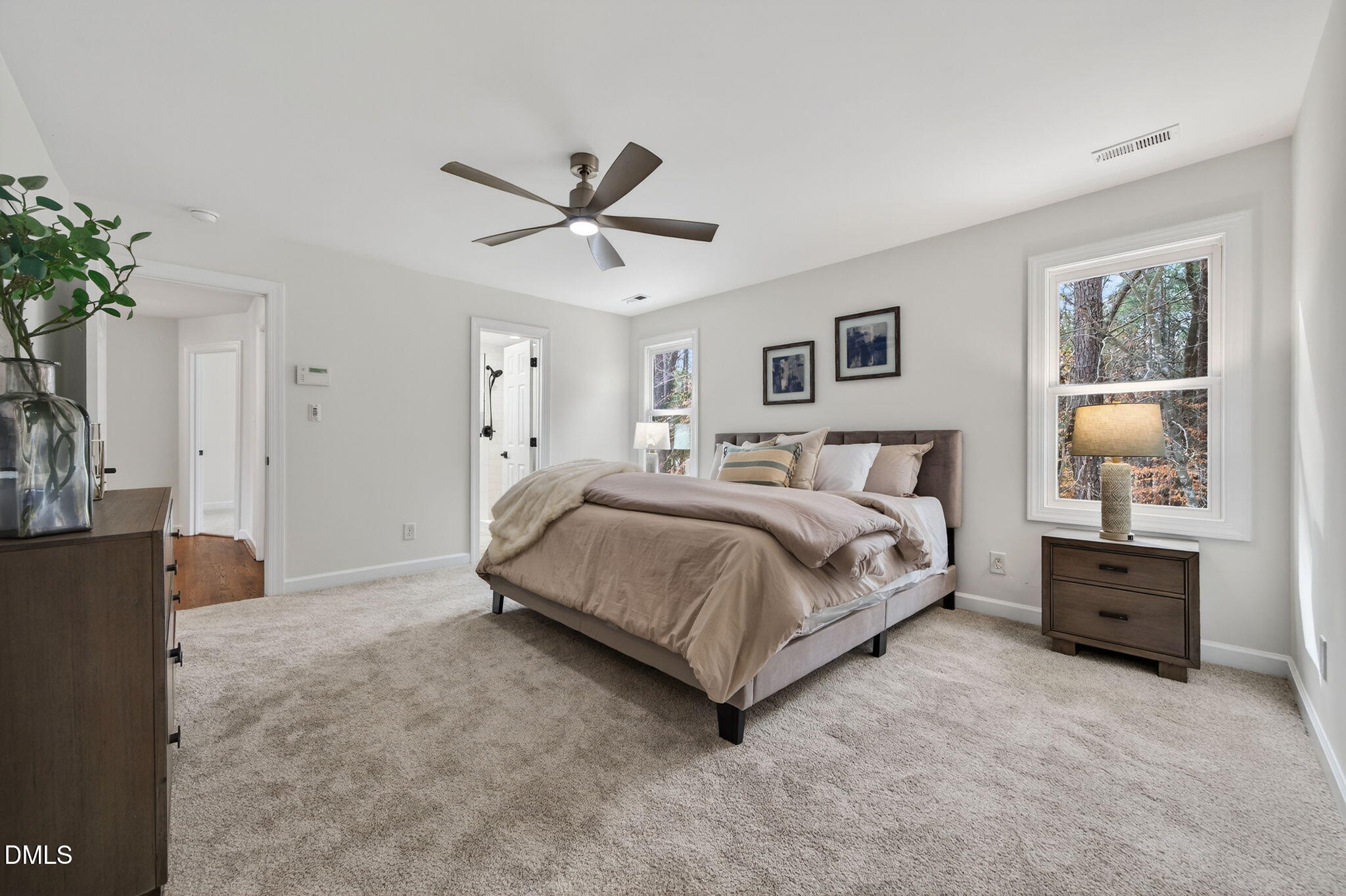 11505 Burberry Drive Raleigh, NC 27614 - Photo 28 of 80 a spacious bedroom with a bed and a chandelier