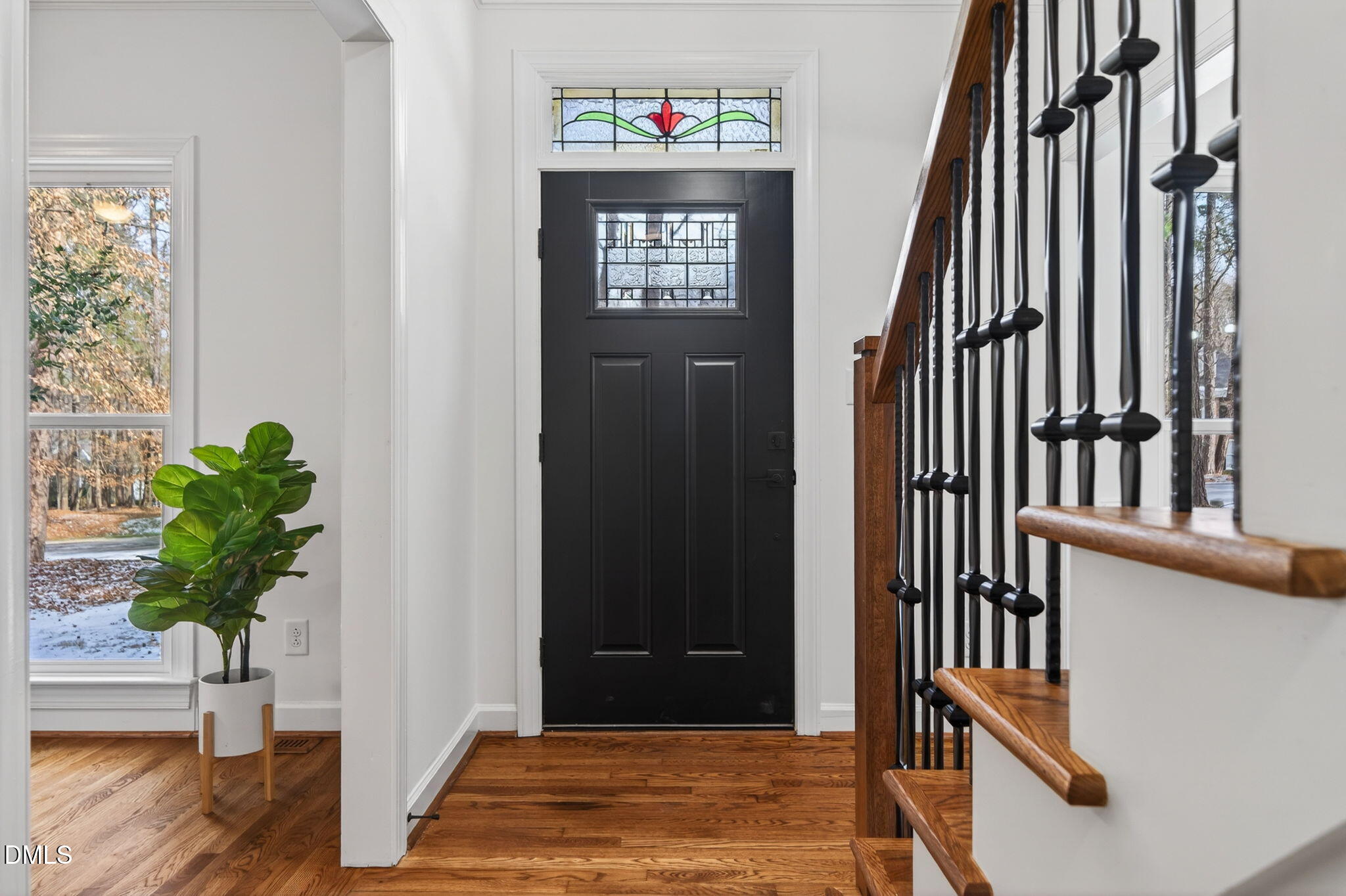 11505 Burberry Drive Raleigh, NC 27614 - Photo 3 of 80 a view of an entryway with wooden floor and stairs