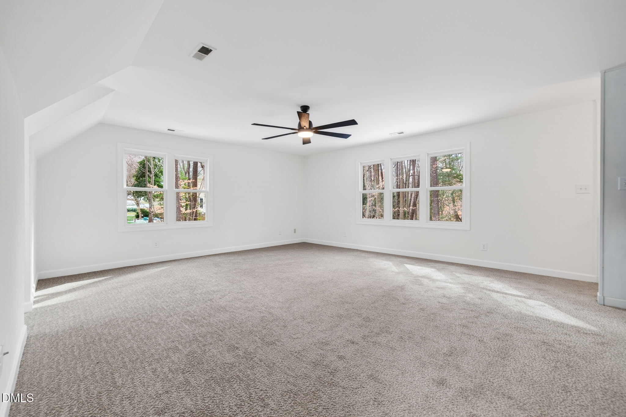 11505 Burberry Drive Raleigh, NC 27614 - Photo 42 of 80 an empty room with windows and ceiling fan