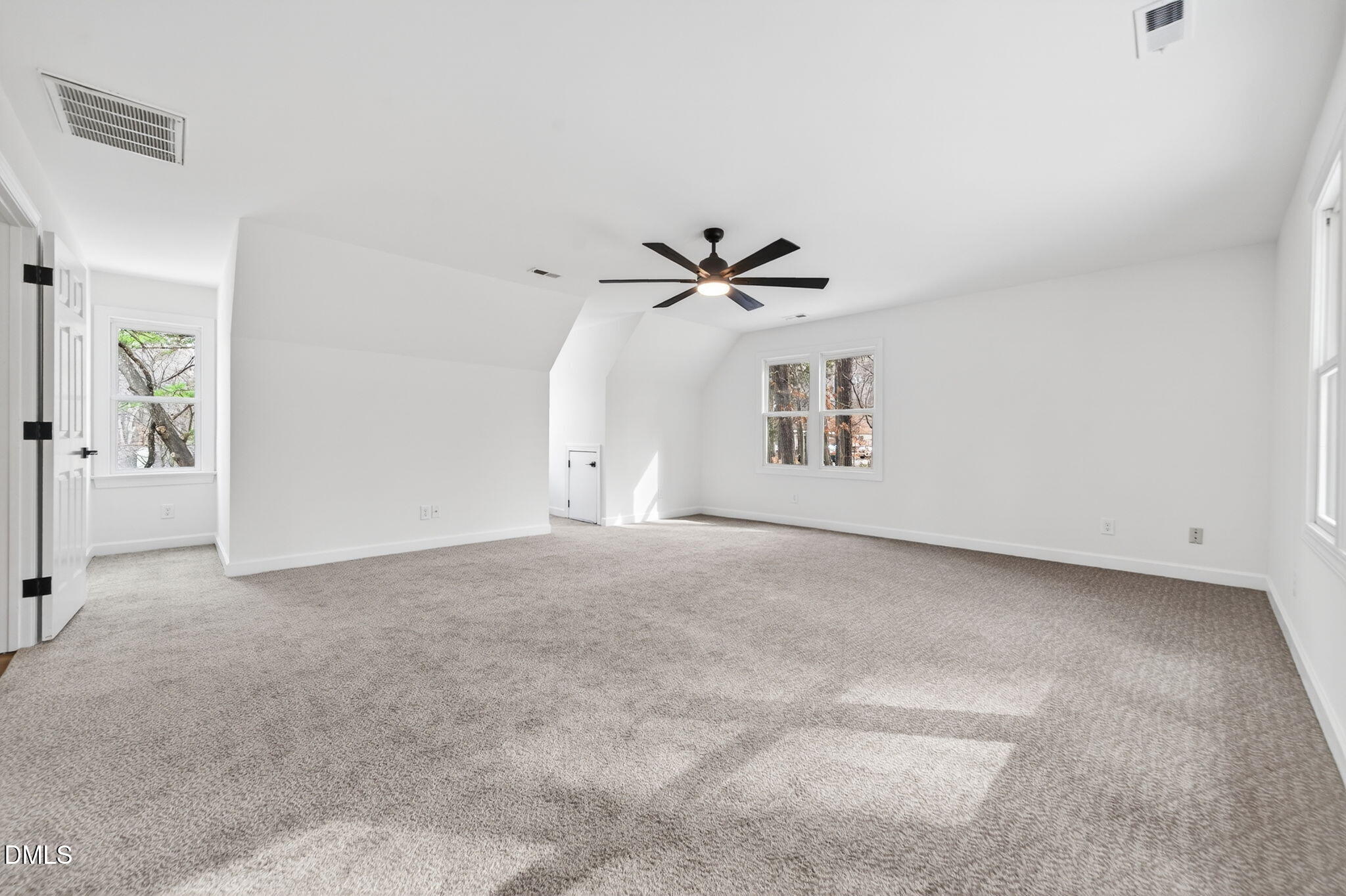 11505 Burberry Drive Raleigh, NC 27614 - Photo 44 of 80 a view of a livingroom with a ceiling fan and window