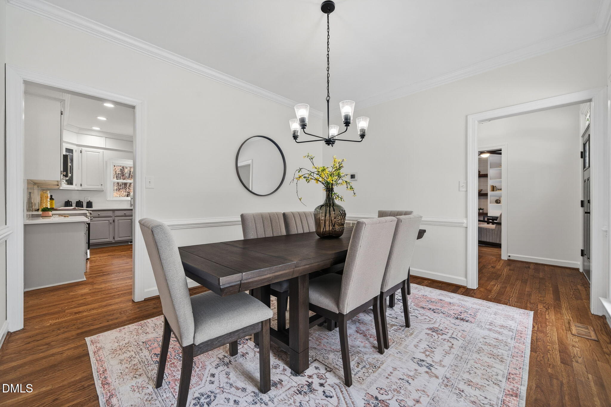 11505 Burberry Drive Raleigh, NC 27614 - Photo 6 of 80 a view of a dining room and livingroom with furniture wooden floor a chandelier