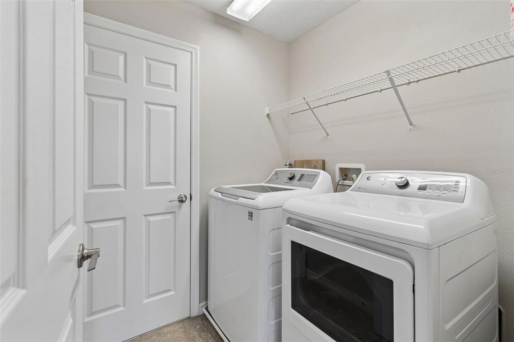 1192 Multiflora Loop Lutz, FL 33558 - Photo 16 of 32 a utility room with dryer and washer