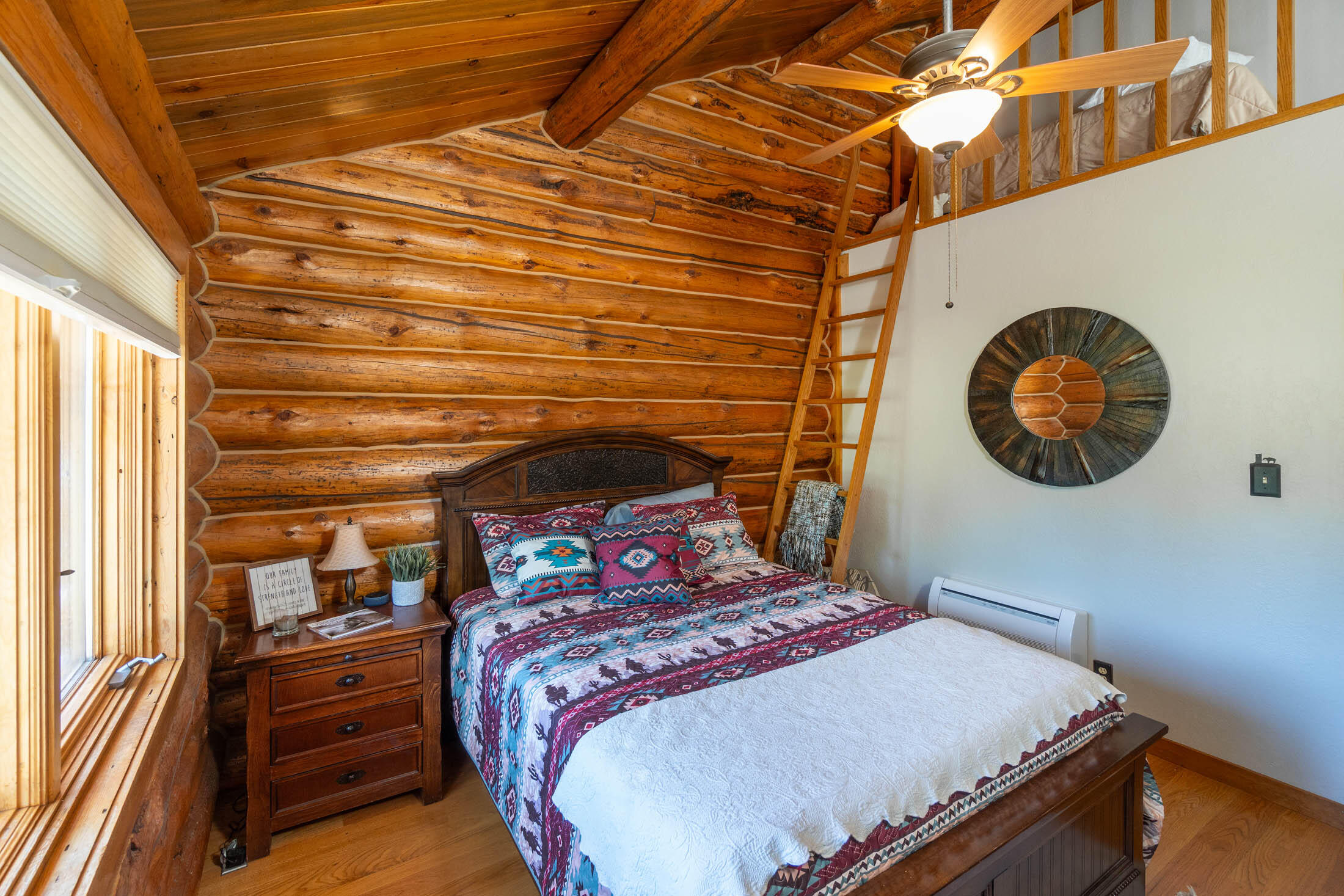 32907 River Bend Road Chiloquin, OR 97624 - Photo 13 of 83 a bedroom with a bed and a chandelier