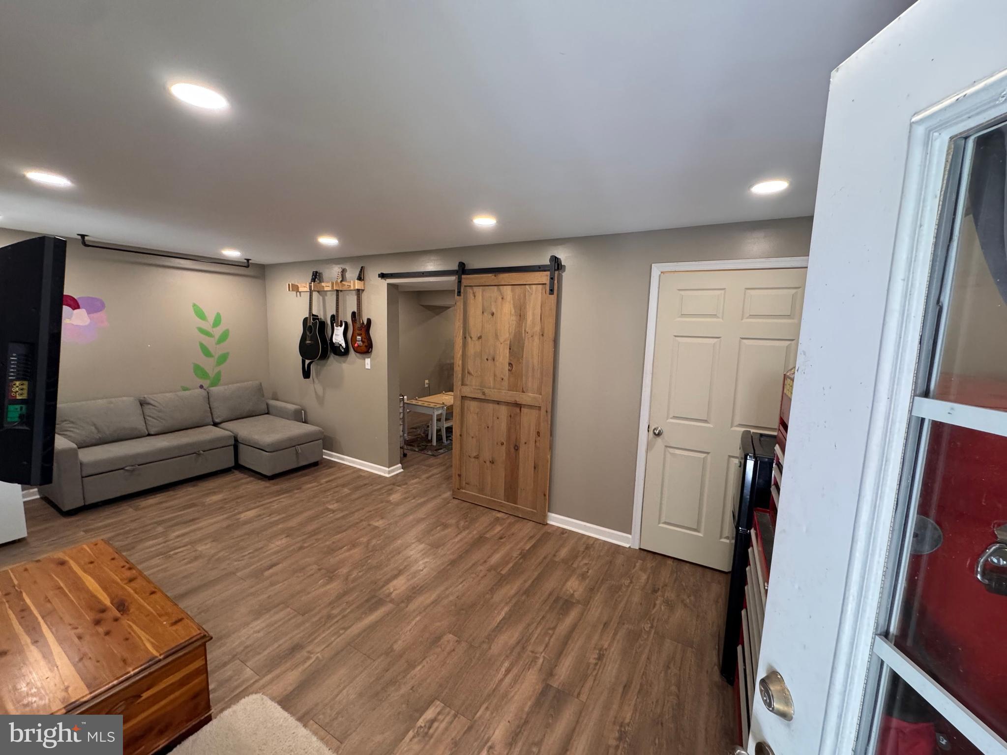 277 McDonald Road Winchester, VA 22602 - Photo 22 of 35 a living room with furniture and a wooden floor