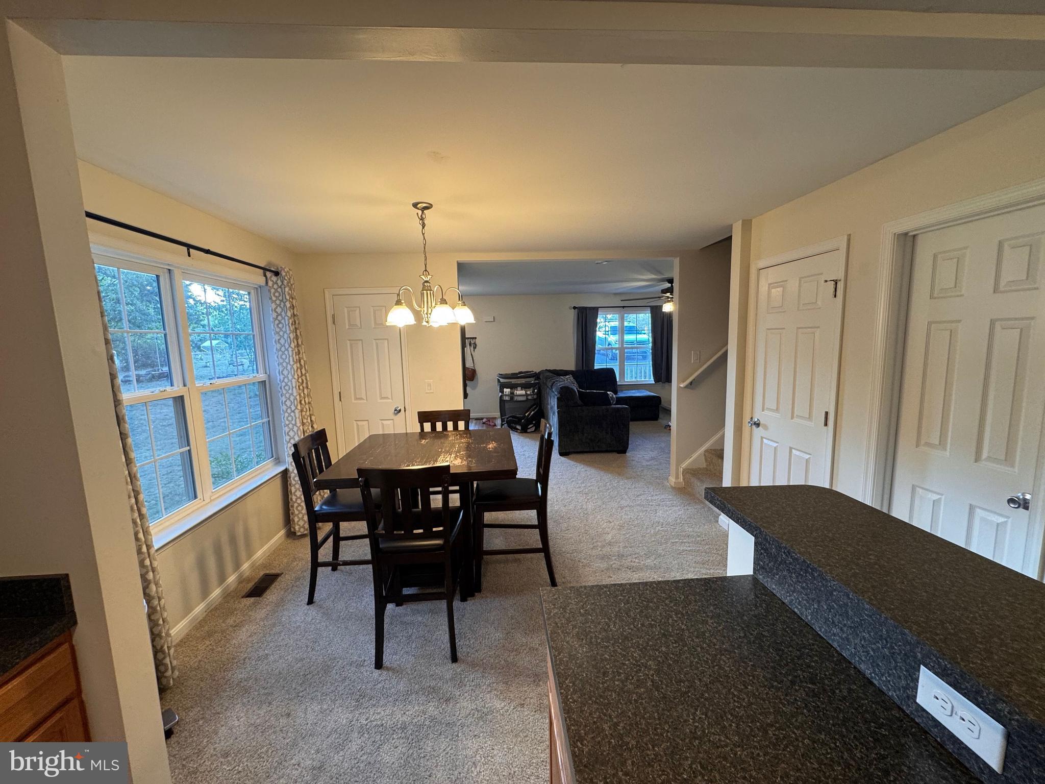 277 McDonald Road Winchester, VA 22602 - Photo 3 of 35 a view of a dining room with furniture and a chandelier