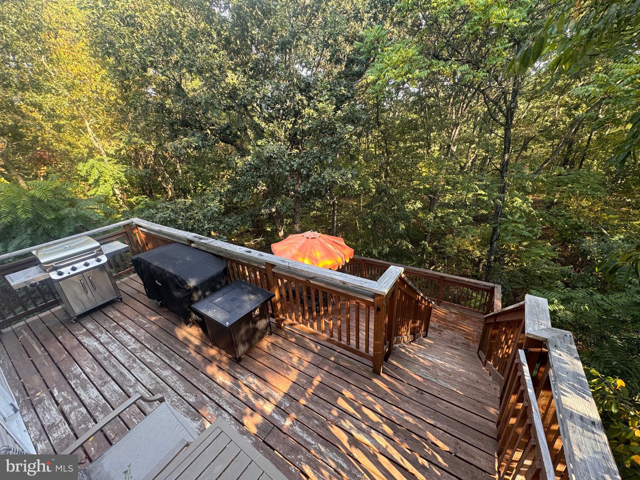 277 McDonald Road Winchester, VA 22602 - Photo 31 of 35 a balcony with wooden floor and outdoor seating