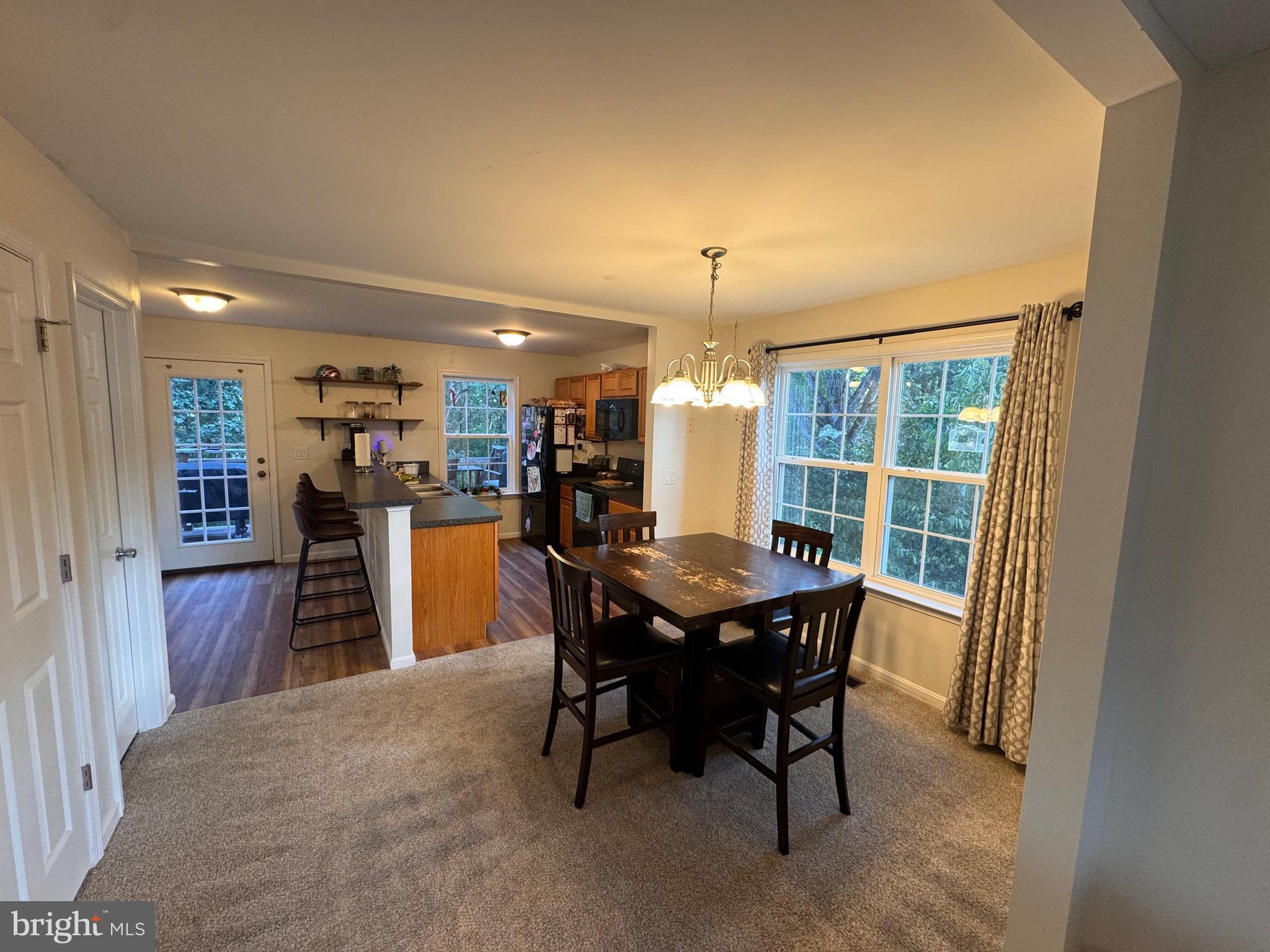 277 McDonald Road Winchester, VA 22602 - Photo 4 of 35 a view of a dining room with furniture window and wooden floor