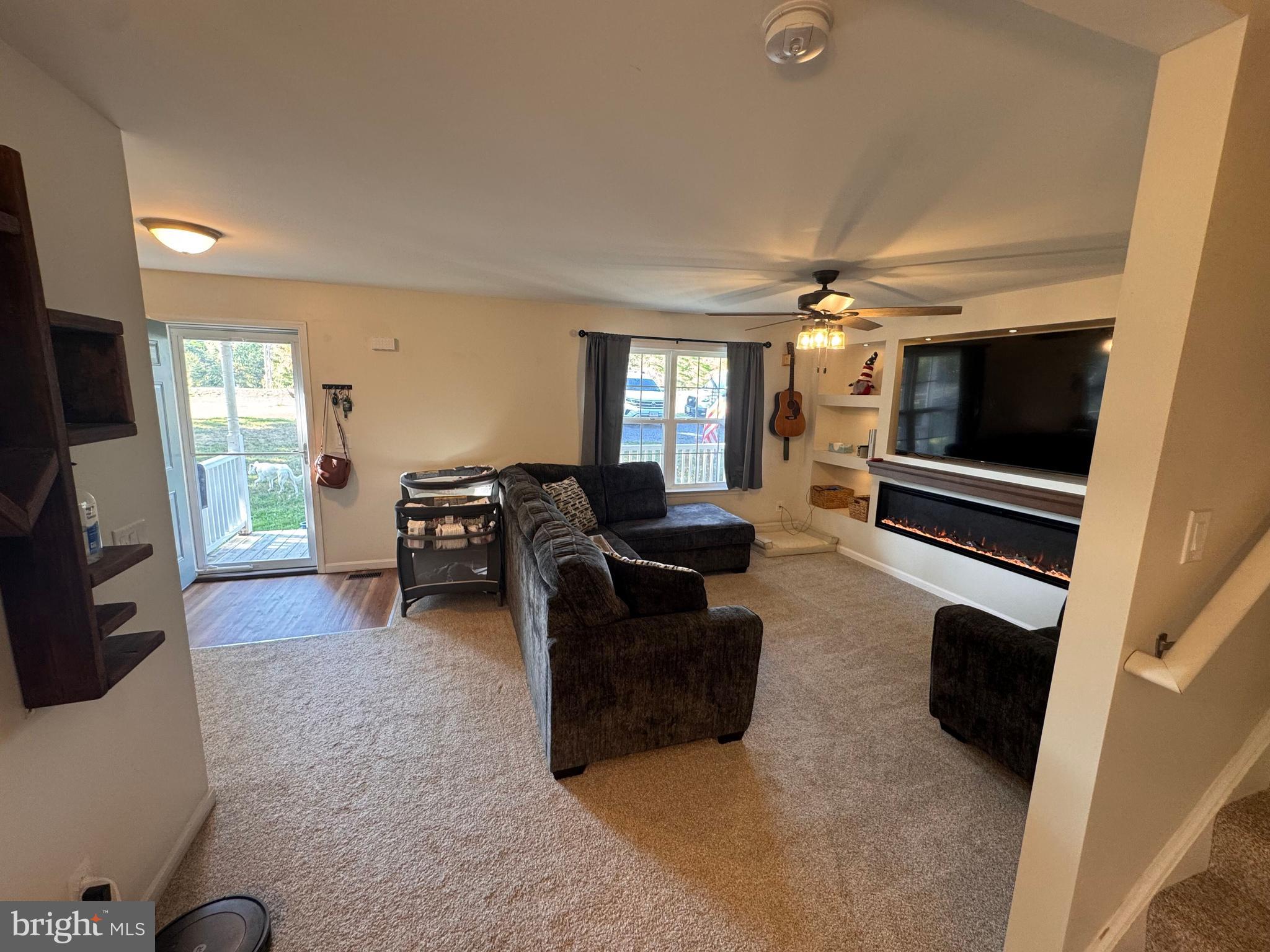 277 McDonald Road Winchester, VA 22602 - Photo 5 of 35 a living room with furniture and a flat screen tv