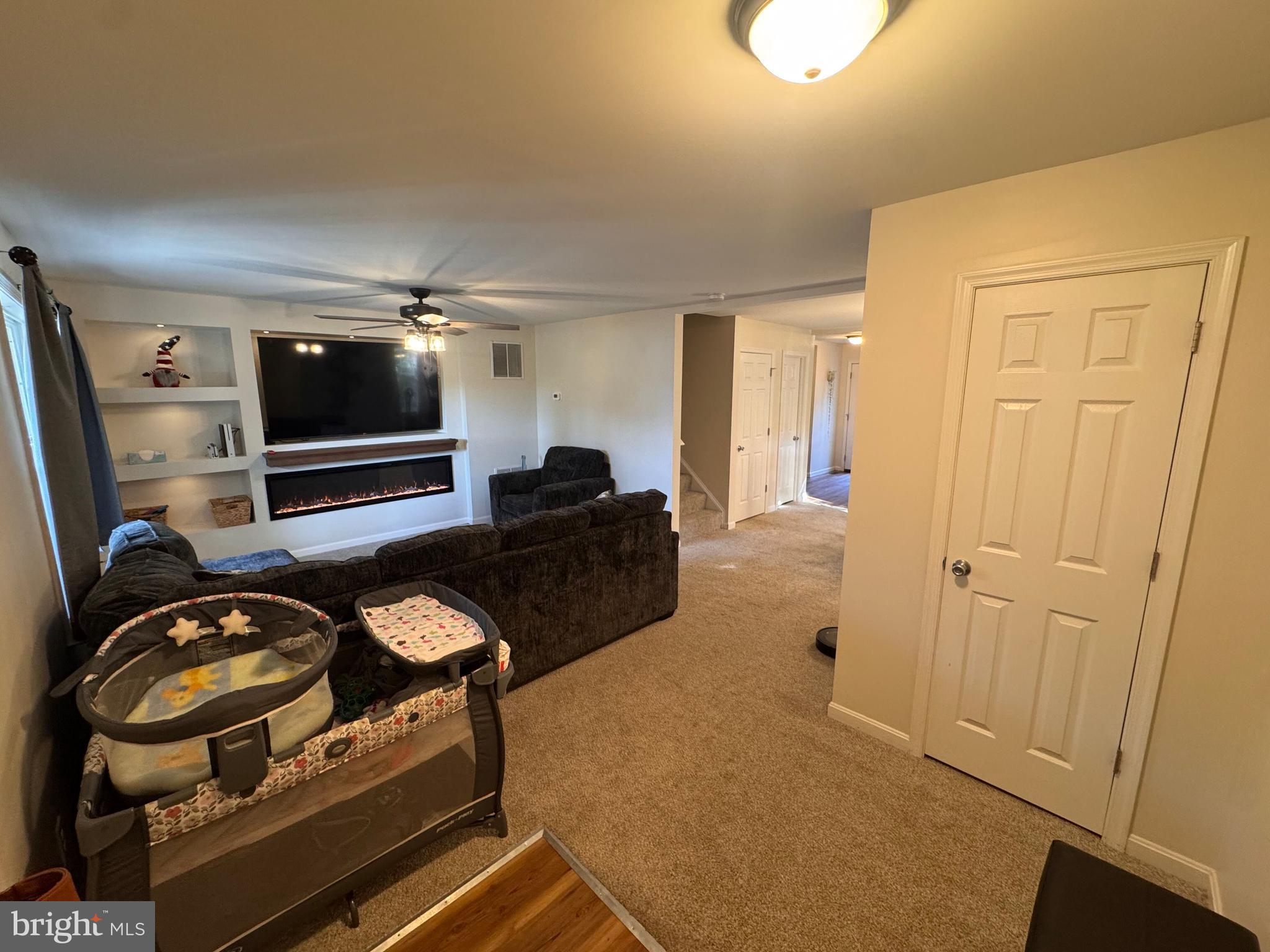 277 McDonald Road Winchester, VA 22602 - Photo 7 of 35 a view of a livingroom with furniture and flat screen tv