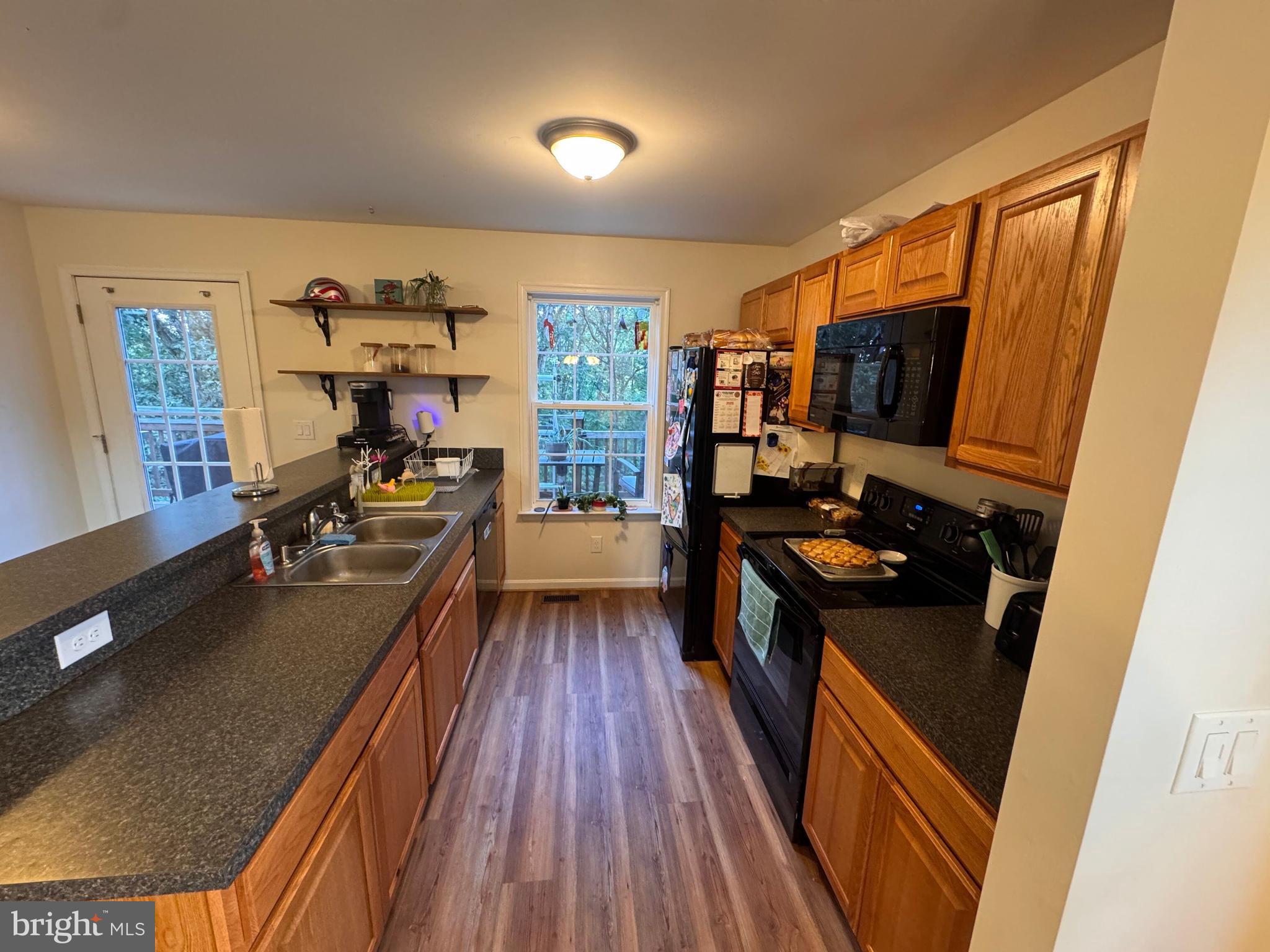 277 McDonald Road Winchester, VA 22602 - Photo 8 of 35 a kitchen with stainless steel appliances a stove top oven and a refrigerator