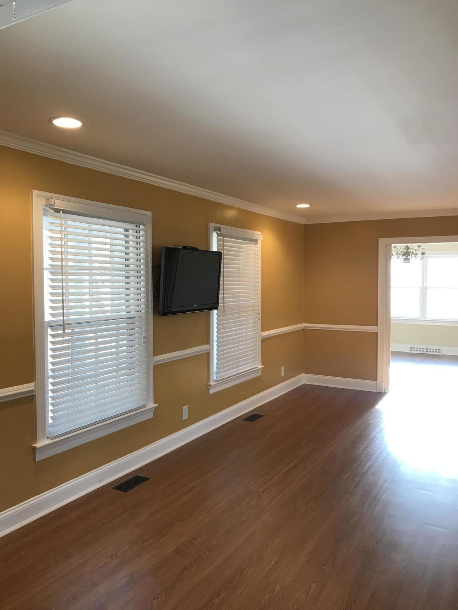 1208 Robin Hill Road Northwest Wilson, NC 27896 - Photo 6 of 31 Living Room- Open to Kitchen and Dining Room LVP Flooring