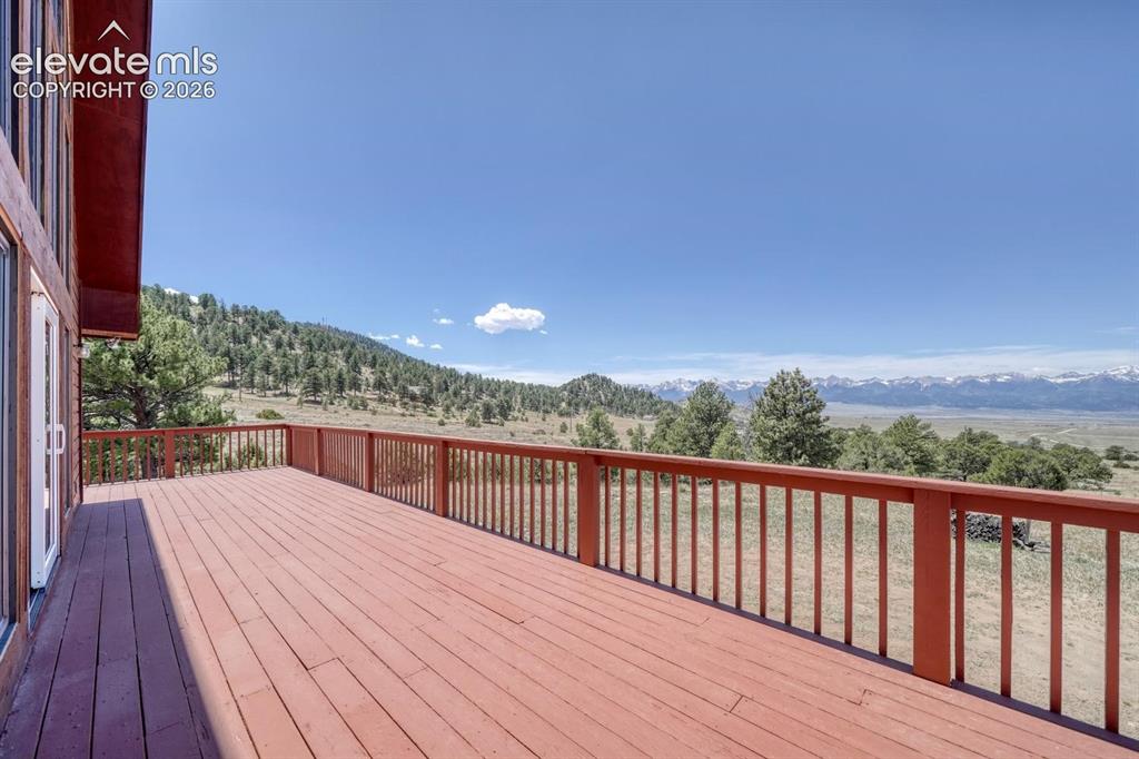 489 Excelsior Road Westcliffe, CO 81252 - Photo 25 of 34 a view of balcony with wooden floor and fence