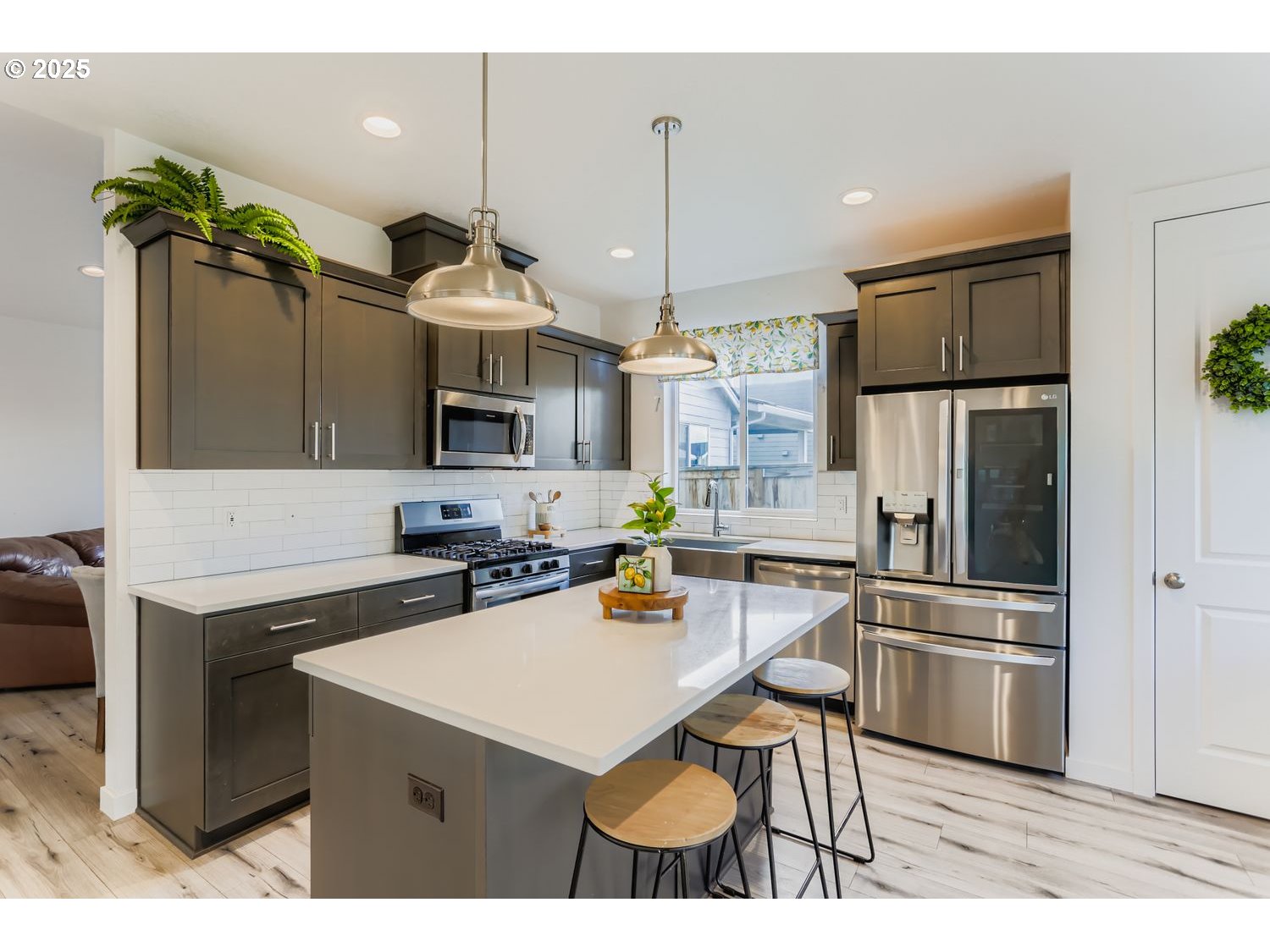 234 West 18th Street Lafayette, OR 97127 - Photo 12 of 27 a kitchen with a sink stainless steel appliances and chandelier