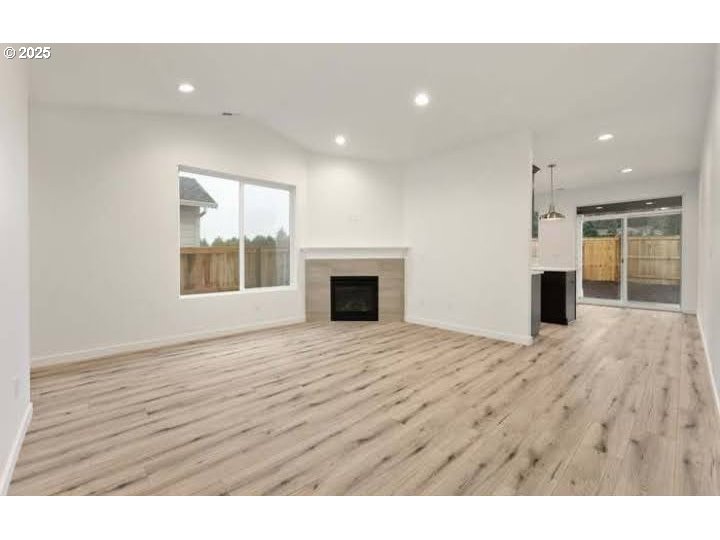 234 West 18th Street Lafayette, OR 97127 - Photo 2 of 27 a view of empty room with wooden floor and fireplace