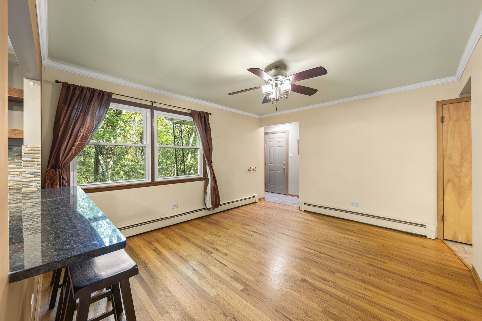 18000 Armitage Court Homewood, IL 60430 - Photo 11 of 23 a view of an empty room with a window and wooden floor