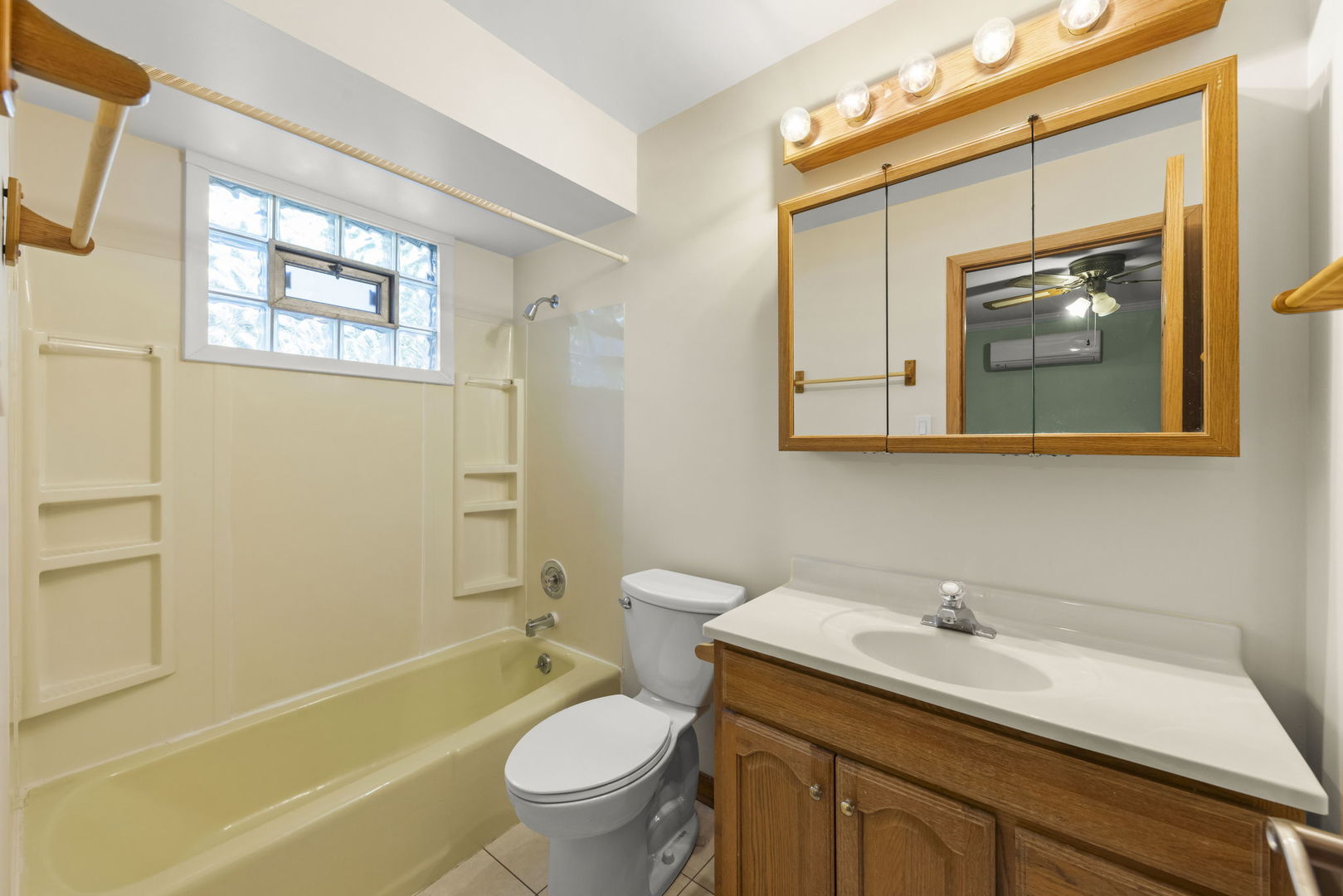 18000 Armitage Court Homewood, IL 60430 - Photo 16 of 23 a bathroom with a sink toilet and shower