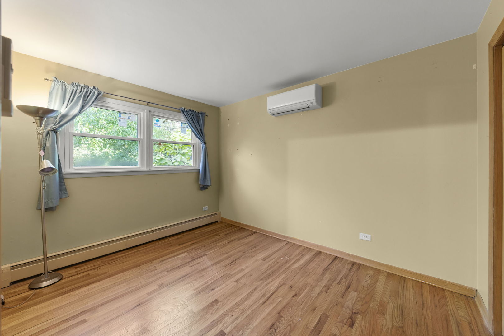 18000 Armitage Court Homewood, IL 60430 - Photo 19 of 23 an empty room with wooden floor and windows
