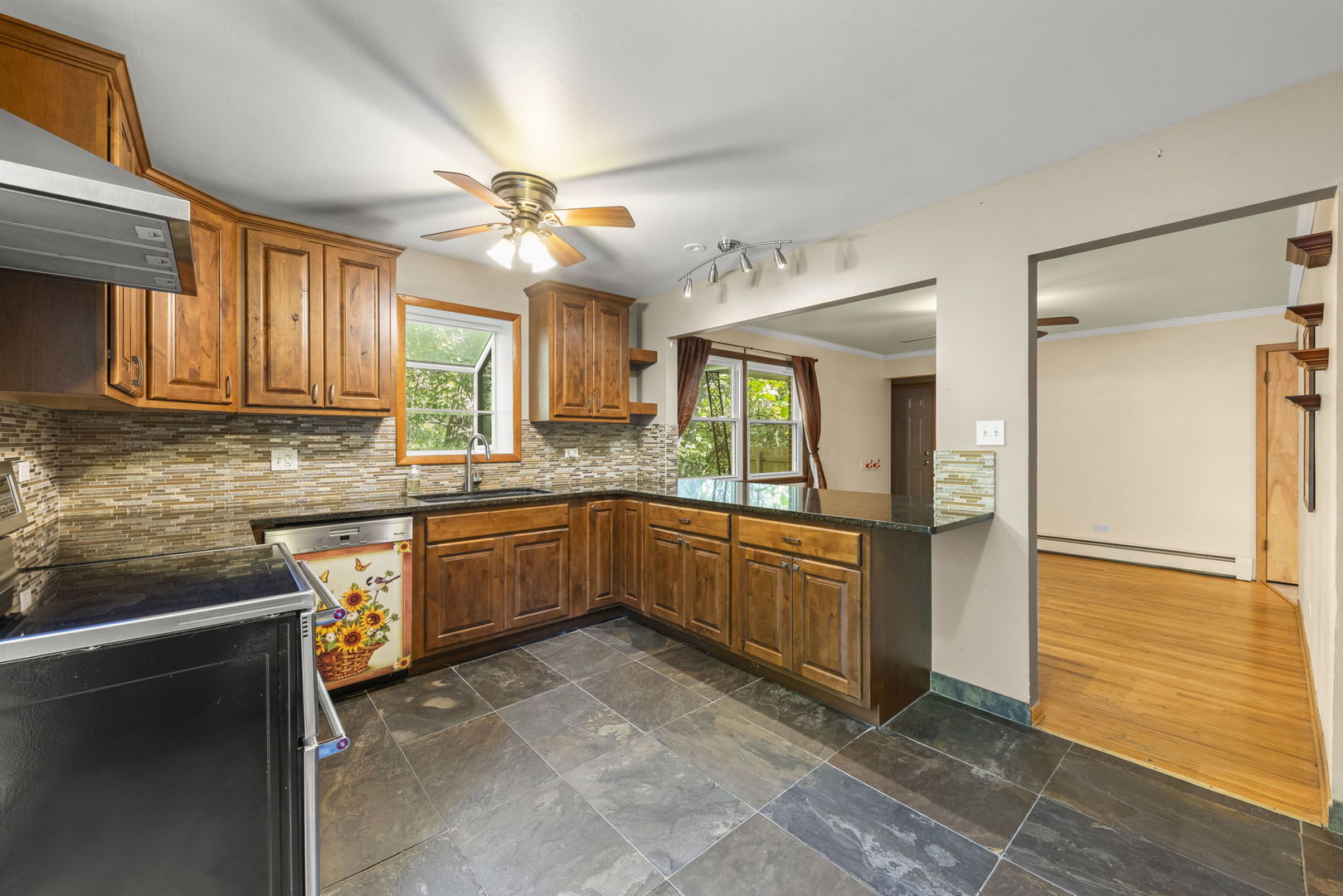 18000 Armitage Court Homewood, IL 60430 - Photo 8 of 23 a kitchen with a refrigerator a sink and dishwasher a oven with wooden cabinets