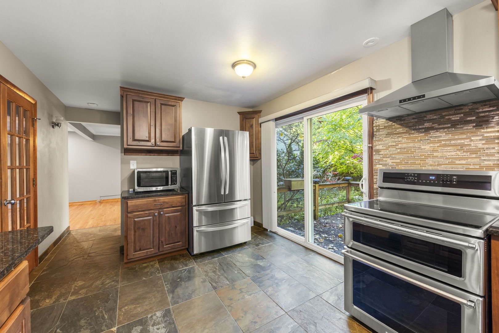 18000 Armitage Court Homewood, IL 60430 - Photo 10 of 23 a kitchen with stainless steel appliances a refrigerator and a sink