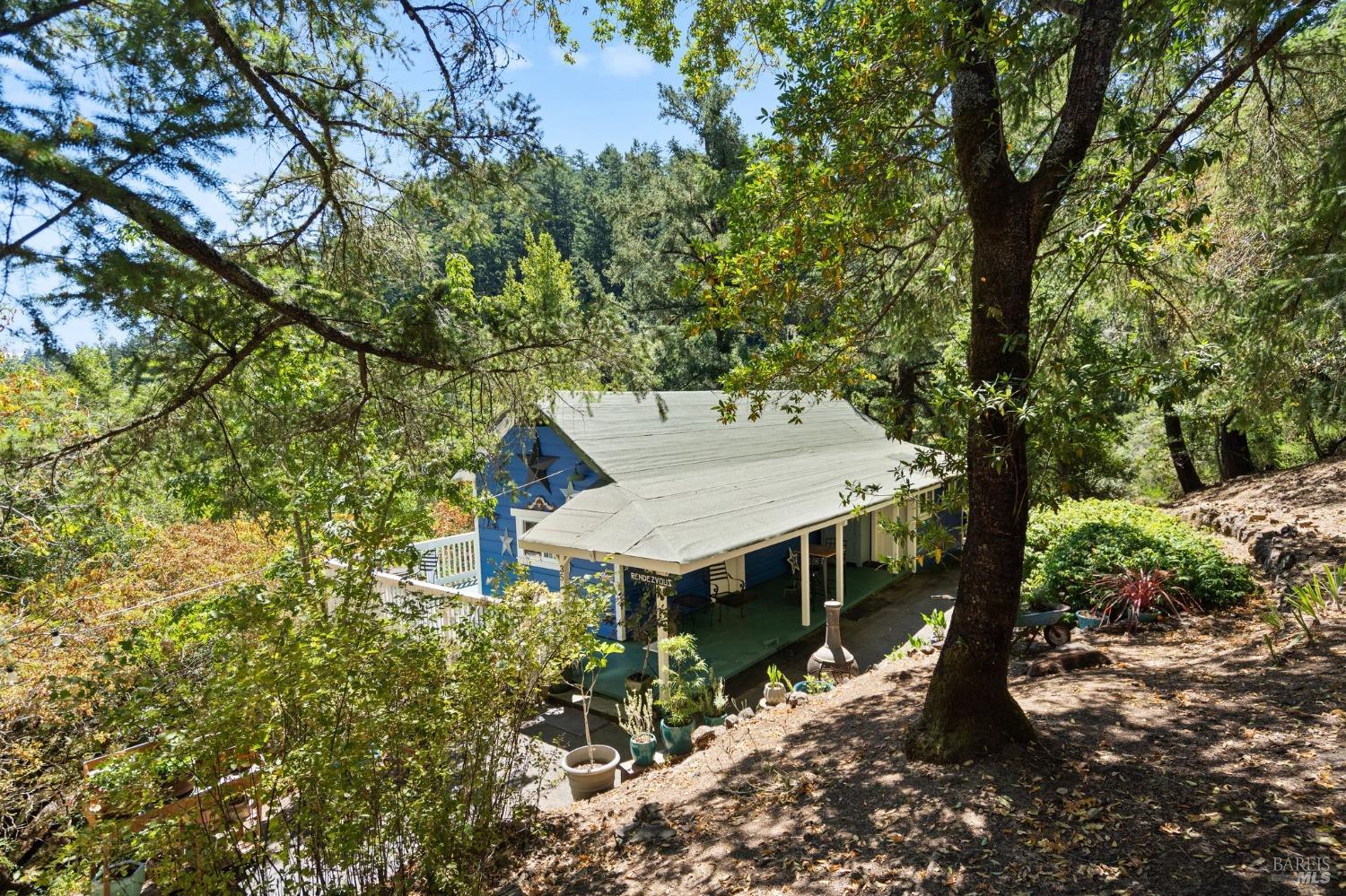 35 East Cintura Avenue Lagunitas, CA 94938 - Photo 1 of 1 front view of a house with a trees