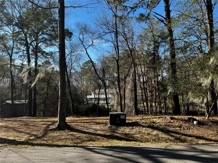 a view of a tree in front of a house