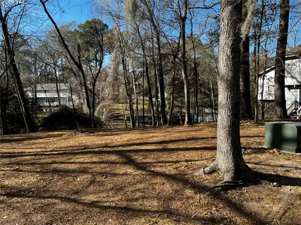a view of outdoor space with deck and tree