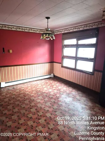 a view of livingroom with hardwood floor and a ceiling fan