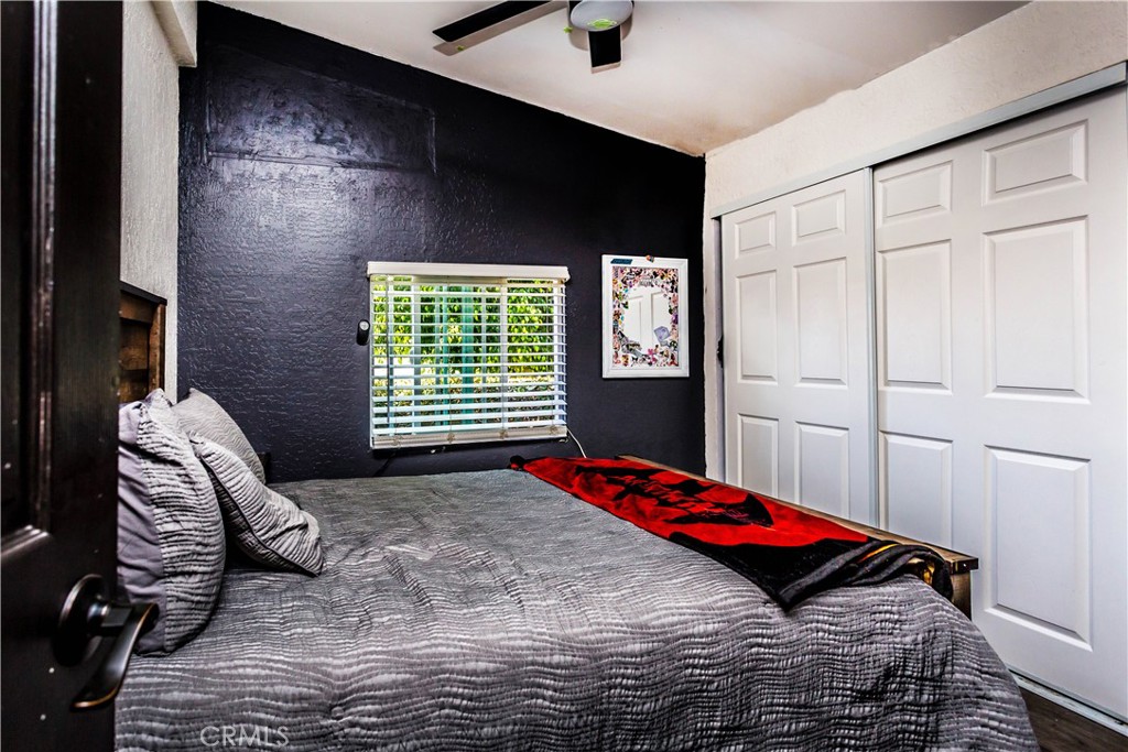 3050 West Ball Road, Unit 200 Anaheim, CA 92804 - Photo 12 of 21 a bed sitting in a bedroom next to a window