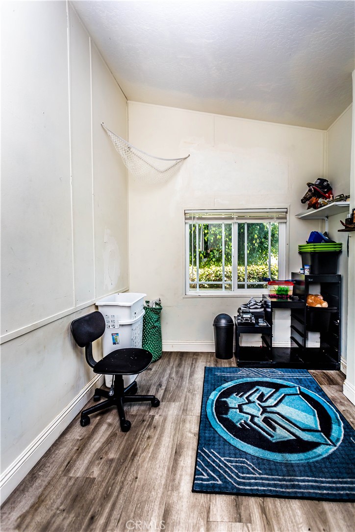 3050 West Ball Road, Unit 200 Anaheim, CA 92804 - Photo 13 of 21 a living room with furniture and a wooden floor