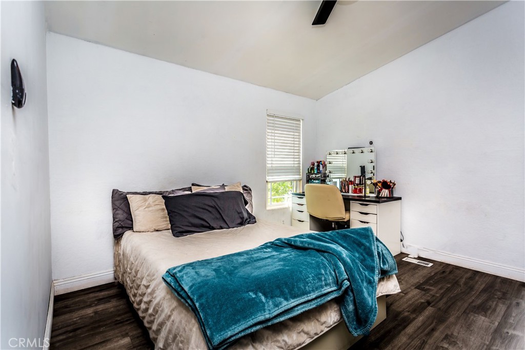 3050 West Ball Road, Unit 200 Anaheim, CA 92804 - Photo 14 of 21 a bedroom with a bed and window