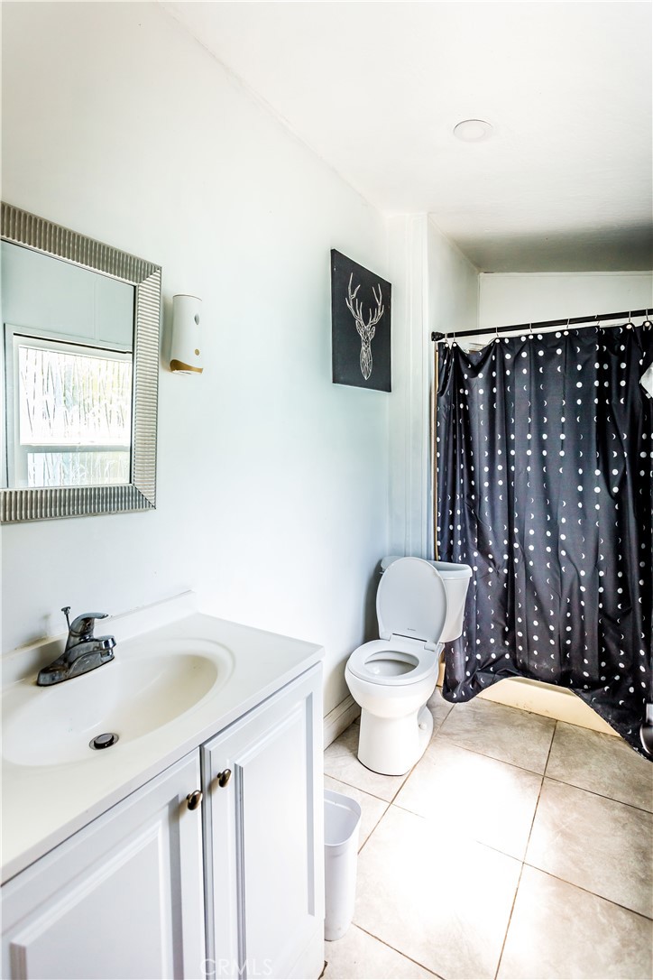 3050 West Ball Road, Unit 200 Anaheim, CA 92804 - Photo 15 of 21 a bathroom with a sink toilet and shower