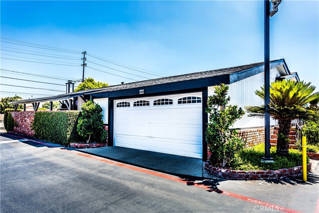 3050 West Ball Road, Unit 200 Anaheim, CA 92804 - Photo 2 of 21 a front view of a house with a garage