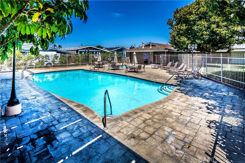 3050 West Ball Road, Unit 200 Anaheim, CA 92804 - Photo 21 of 21 a view of a house with pool and chairs