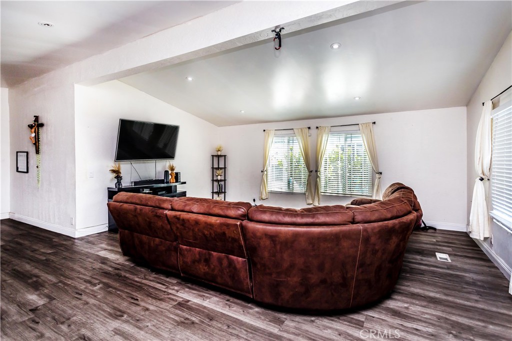 3050 West Ball Road, Unit 200 Anaheim, CA 92804 - Photo 3 of 21 a living room with furniture and a flat screen tv