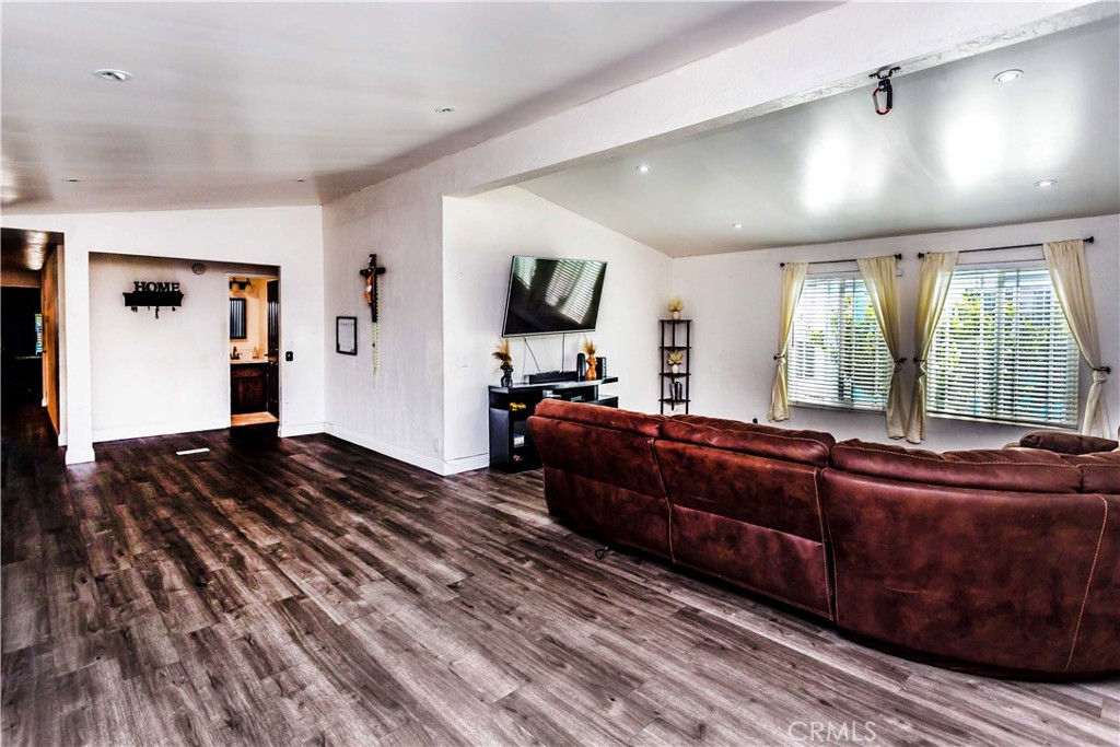3050 West Ball Road, Unit 200 Anaheim, CA 92804 - Photo 4 of 21 a living room with couch and a window