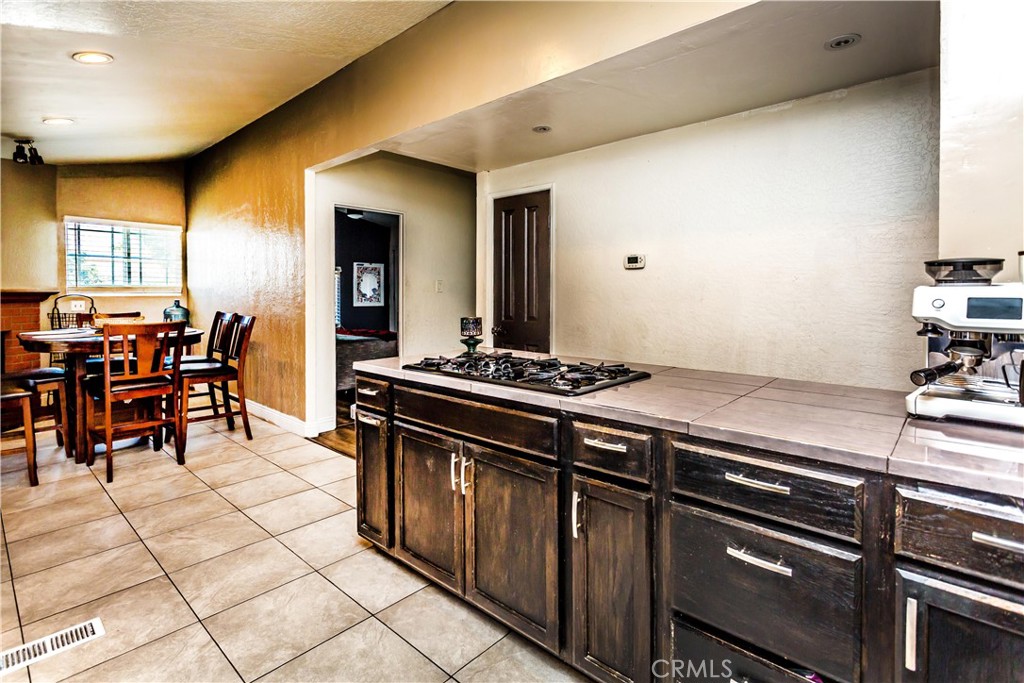 3050 West Ball Road, Unit 200 Anaheim, CA 92804 - Photo 5 of 21 a kitchen with stainless steel appliances granite countertop a stove a sink and a refrigerator