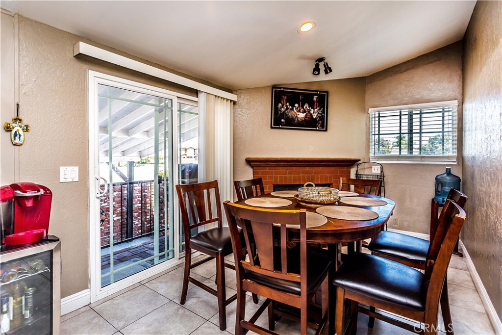 3050 West Ball Road, Unit 200 Anaheim, CA 92804 - Photo 6 of 21 a view of a dining room with furniture and wooden floor