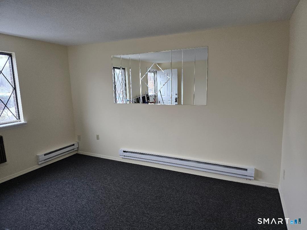 1440 Meriden Road, Unit 7 Waterbury, CT 06705 - Photo 2 of 6 an empty room with a window