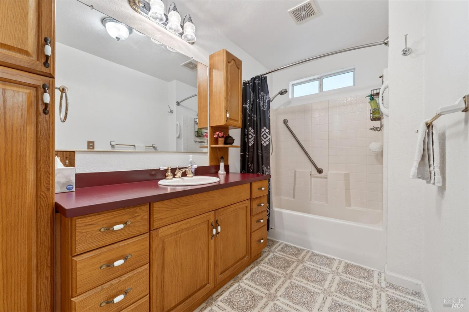 810 McNab Ranch Road Ukiah, CA 95482 - Photo 15 of 32 a bathroom with a double vanity sink and mirror